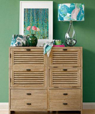 reclaimed or limed oak furniture looks relaxed and rustic with palm greens