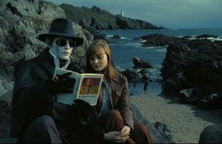 A vampiric Johnny Depp reads a story to Bella Heathcote in 'Dark Shadows'