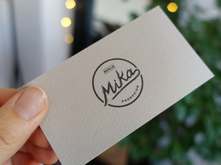 Generous use of whitespace can help give a sophisticated, high-end look to your business cards