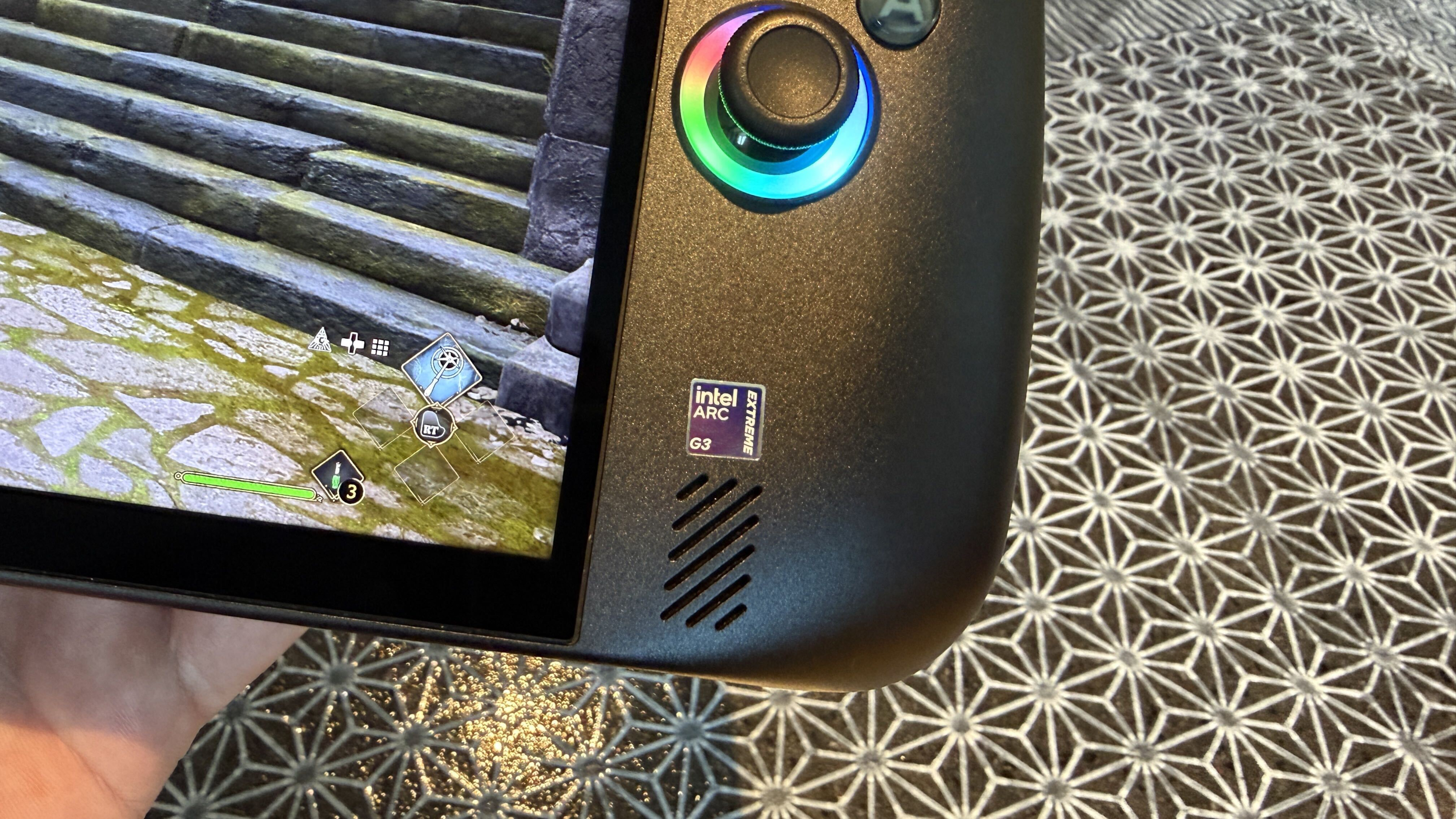 Close-up of an Acer Predator Atlas 8 handheld gaming device showing Intel Arc G3 Extreme badge.