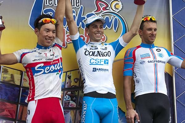 The stage seven podium (l-r): Joon Yong Seo (2nd, Seoul Cycling), Marco Canola (1st, Colnago CSF Inox) and Serguy Klimov (3rd,Rusvelo).