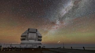 A round dome and three straight lines forming a triangle over a golden starry background