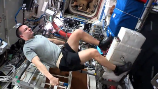 Andrew Morgan bikes with CEVIS on the space station.