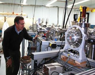 Greg Hodgins checks on the accelerator mass spectrometer, which narrowed the age of the book down to 1404 to 1438, in the early Renaissance.