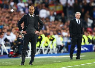 Josep Guardiola, coach of Bayern Muenchen looks dejected with Carlo Ancelotti, coach of Real Madrid during the UEFA Champions League semi-final first leg match between Real Madrid and FC Bayern Muenchen at the Estadio Santiago Bernabeu on April 23, 2014 in Madrid, Spain.