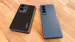 The Oppo Find N2 and the Samsung Galaxy Z Fold 4, closed on a table together