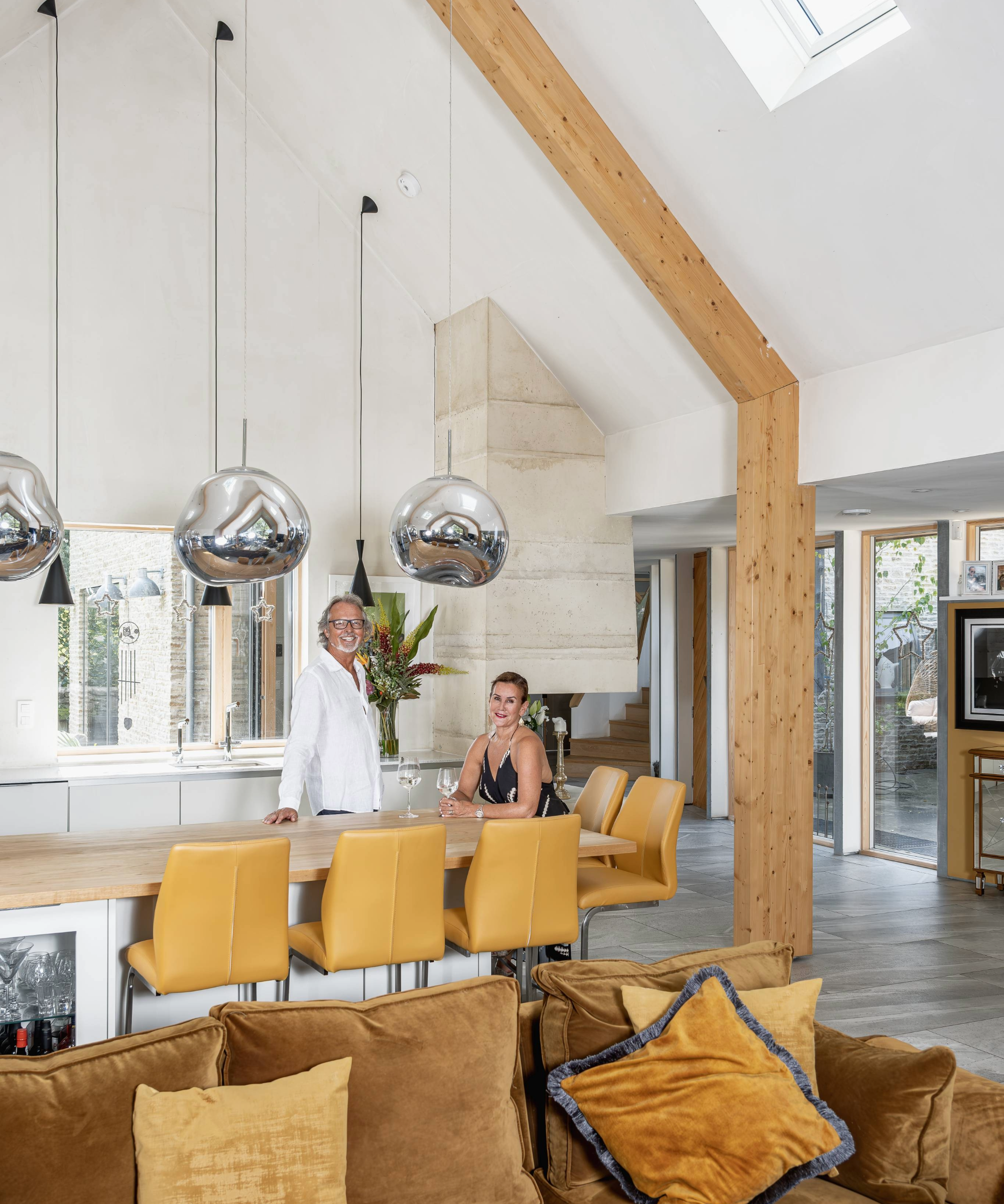 The owners by a table in the living area