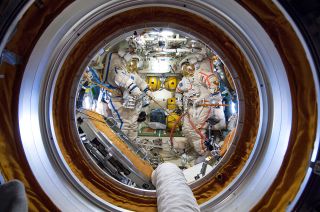 The view looking inside Russia's Pirs docking compartment from on board the International Space Station on the eve of a 2014 spacewalk.