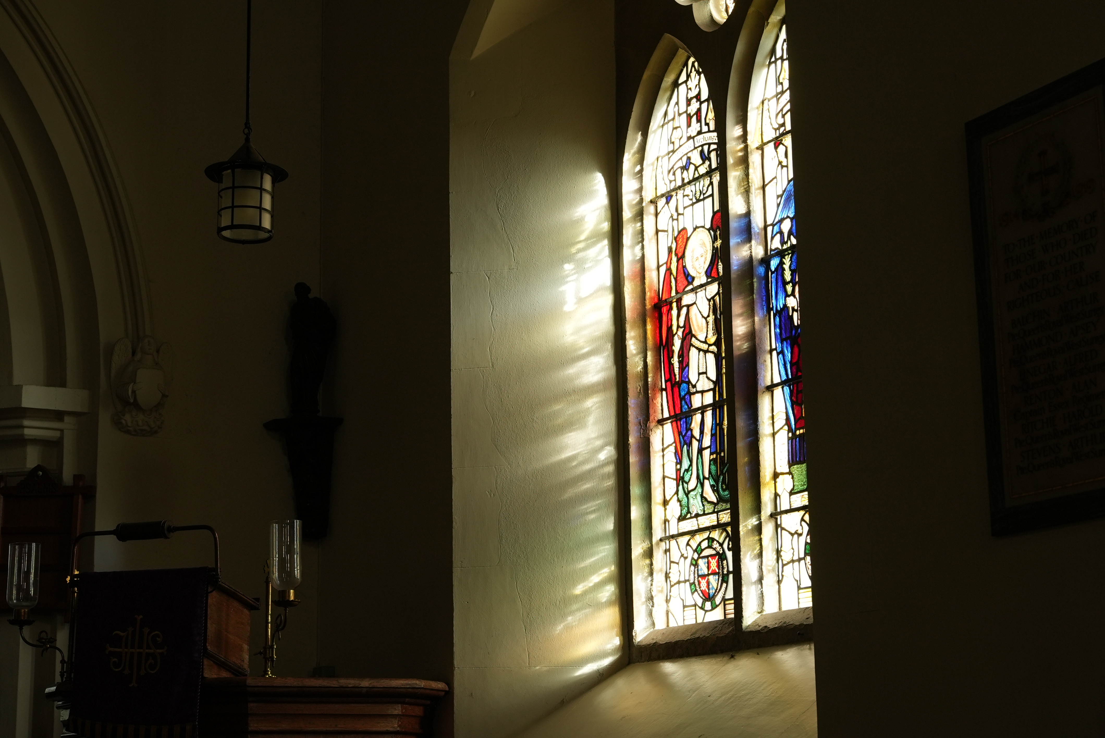 A stained glass window with light coming through it