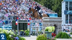Scott Brash and Hello Jefferson jump a fence at the Paris Olympics