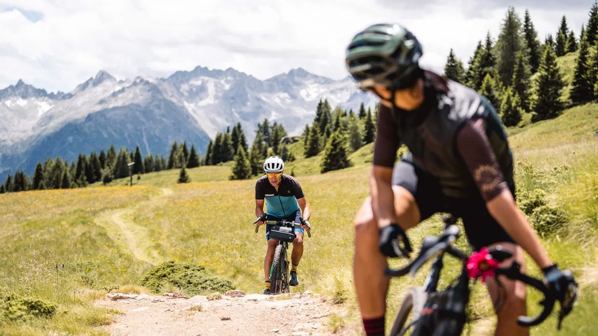 Gravel riders riding and enjoying the views in Val di Sole, Italy