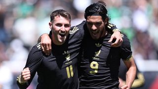 Santiago Gimenez #11 of Mexico celebrates after scoring his teammates first goal with his teammate Raul Jimenez #9