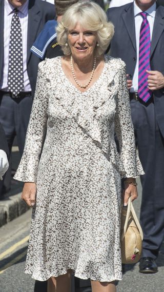 Queen Camilla in a ruffled printed dress