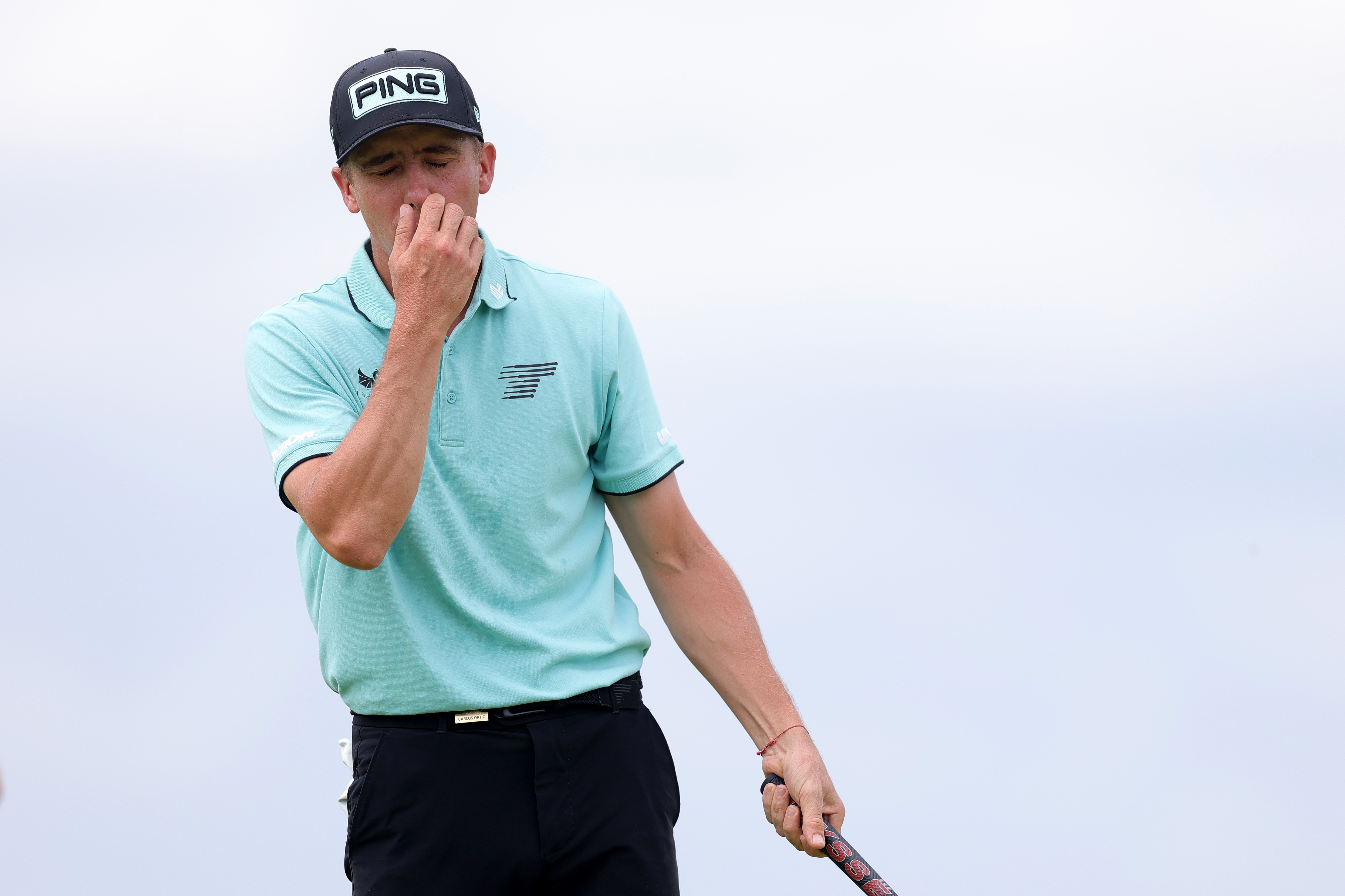Carlos Ortiz grimaces after a missed putt