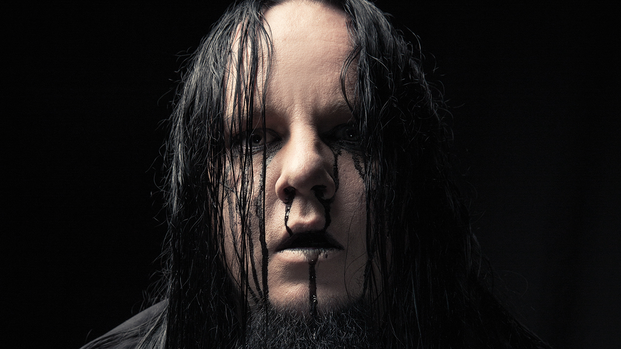 A portrait of Joey Jordison with black blood running from his nose