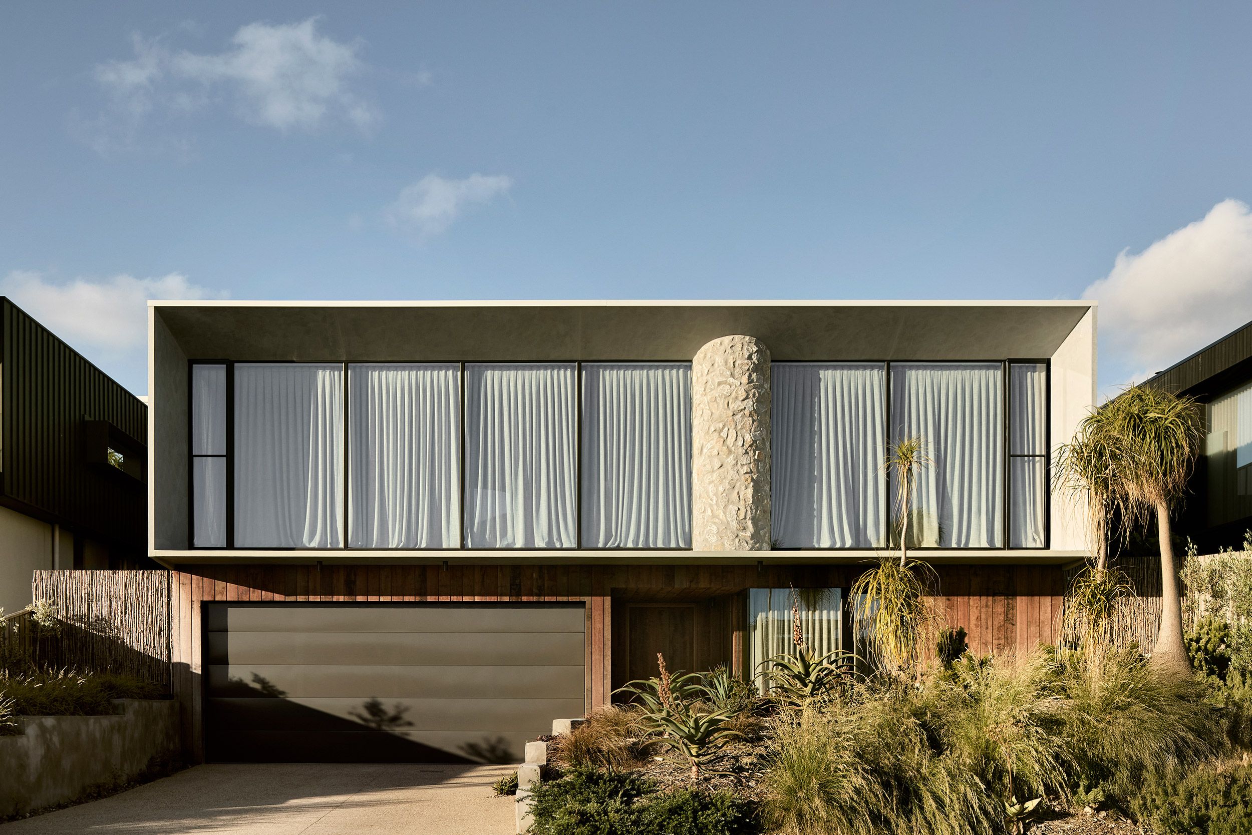 Coastal House is perfectly set into the contours of its Australian landscape