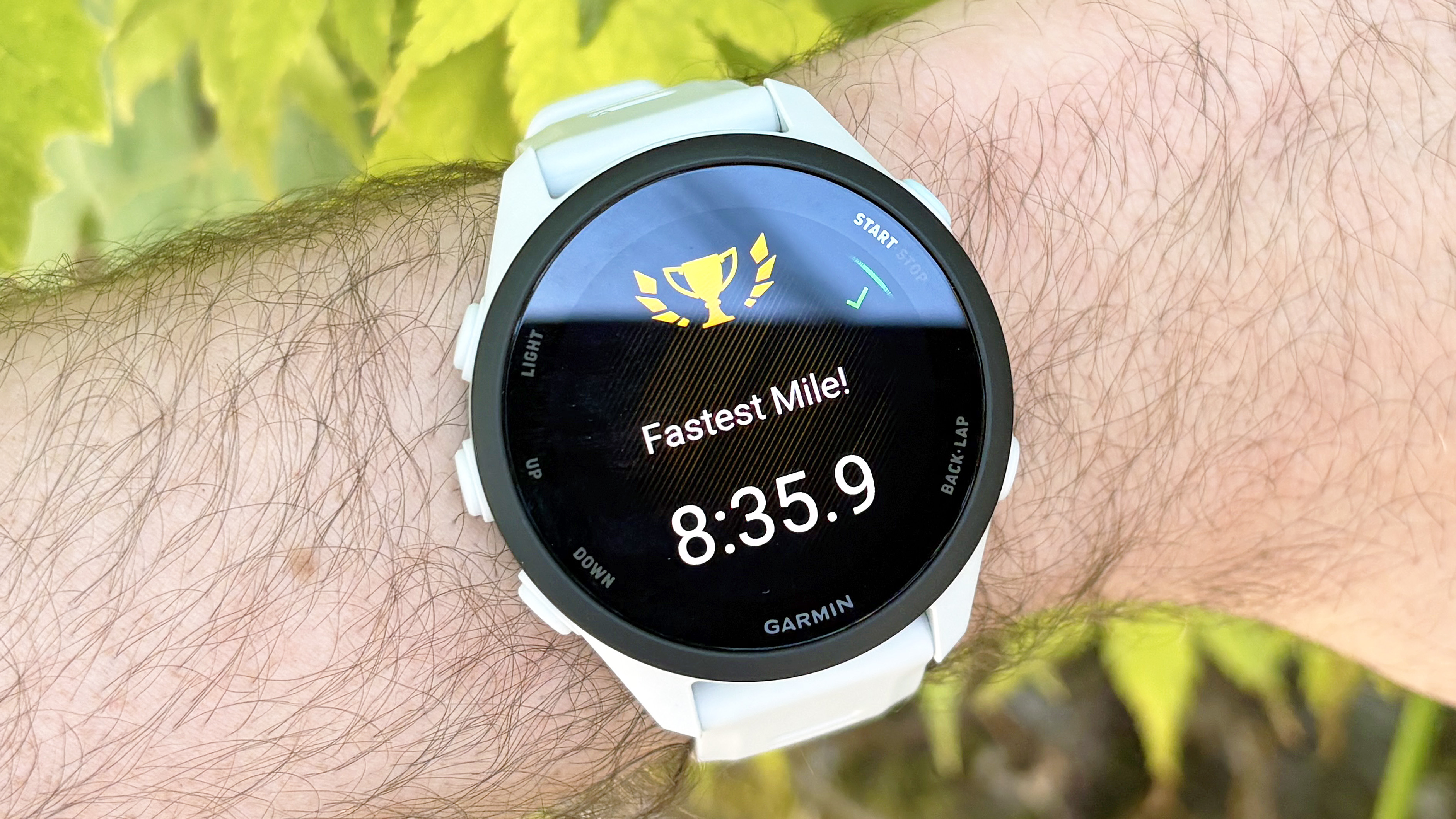 Close-up of the Garmin Forerunner 70 entry-level running watch in white