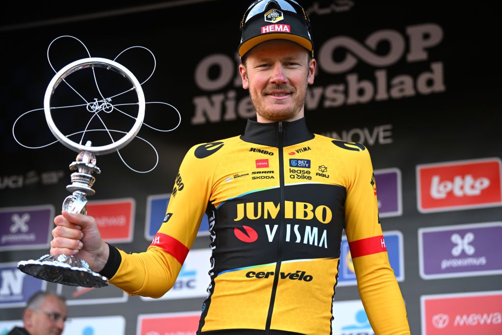 NINOVE BELGIUM FEBRUARY 25 Dylan Van Baarle of The Netherlands and Team JumboVisma celebrates at podium as race winner during the 78th Omloop Het Nieuwsblad Elite 2023 Mens Elite a 2073km one day race from Ghent to Ninove OHN23 on February 25 2023 in Ninove Belgium Photo by Luc ClaessenGetty Images