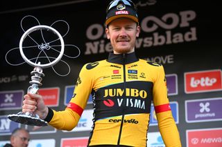 NINOVE BELGIUM FEBRUARY 25 Dylan Van Baarle of The Netherlands and Team JumboVisma celebrates at podium as race winner during the 78th Omloop Het Nieuwsblad Elite 2023 Mens Elite a 2073km one day race from Ghent to Ninove OHN23 on February 25 2023 in Ninove Belgium Photo by Luc ClaessenGetty Images