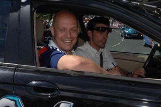 Dave Brailsford looks confident as Sky team car heads out behind bunch