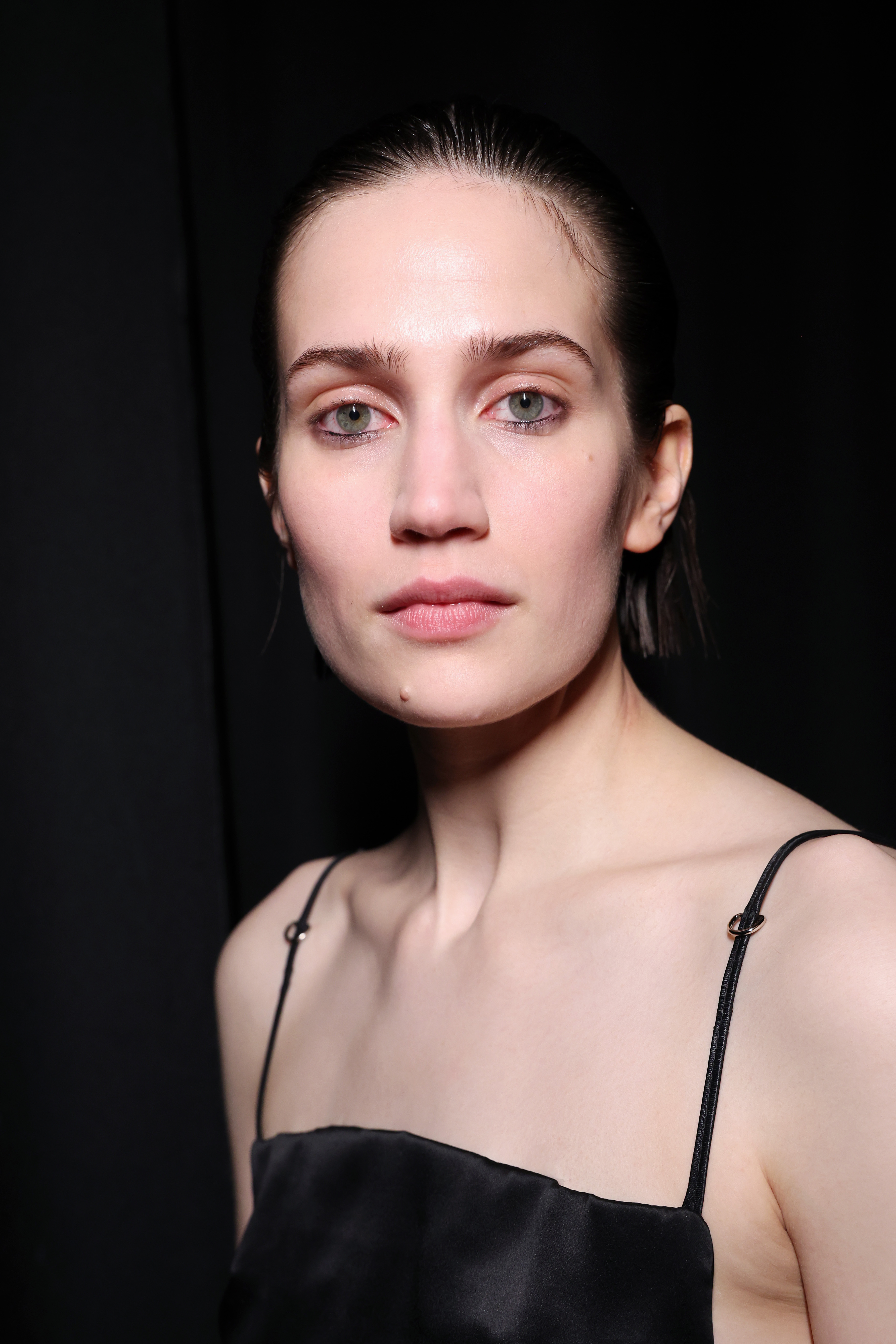 A model poses backstage at the Vain show during the Copenhagen Fashion Week AW24