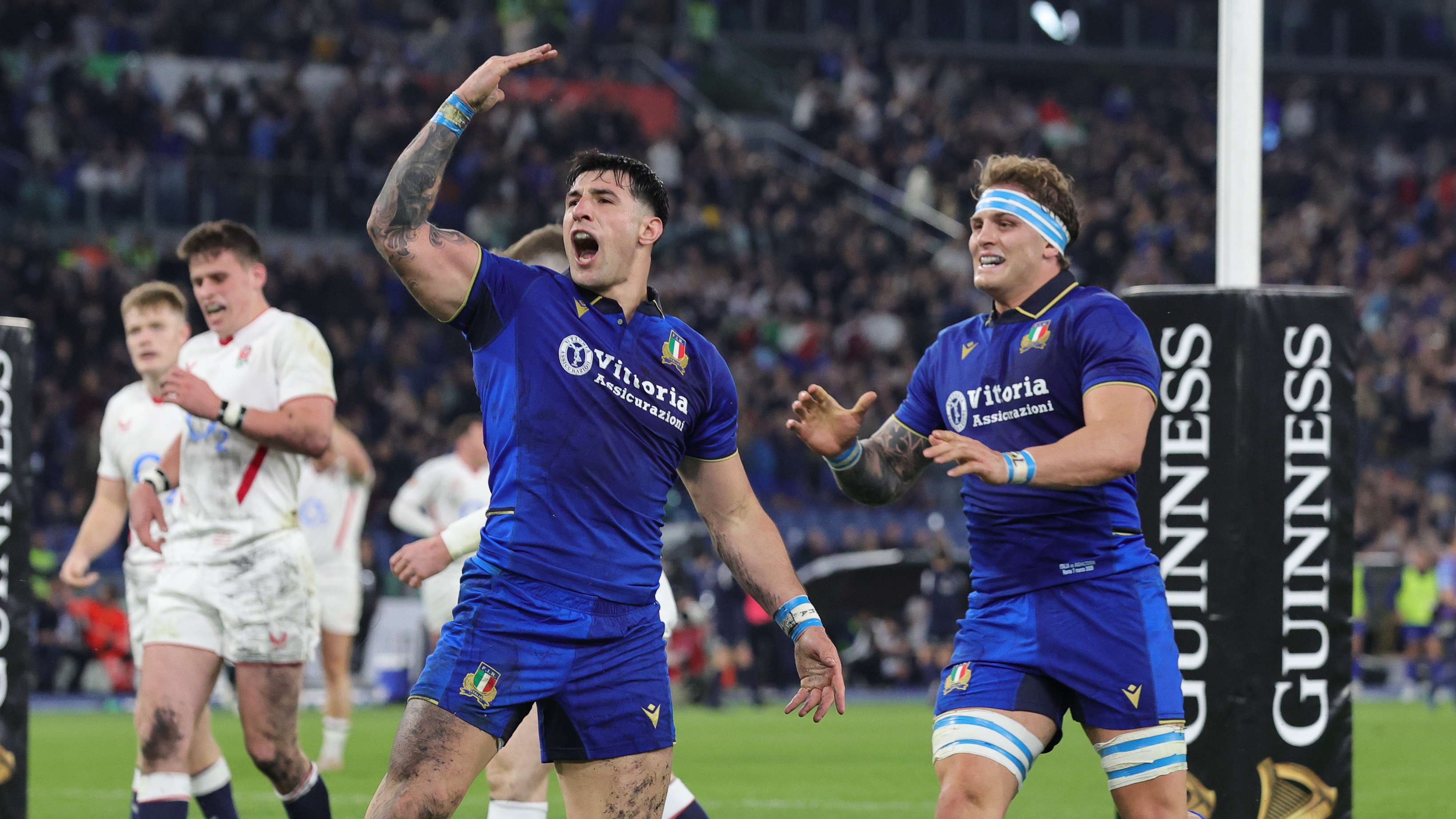 Tommaso Meloncello of Italy national rugby union team celebrates with teammates after scoring a try the fourth match day of the Guinness Six Nations tournament between Italy and England on March 7, 2026 at the Stadium Olimpico in Rome, Italy. 