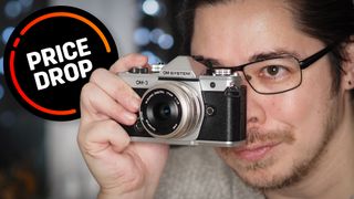 James Artaius holding an OM System OM-3