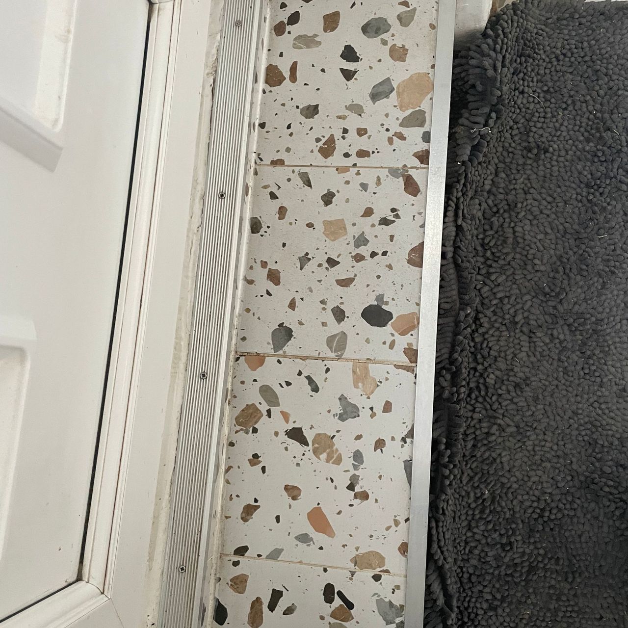Clean terrazzo tiled step after steam cleaning