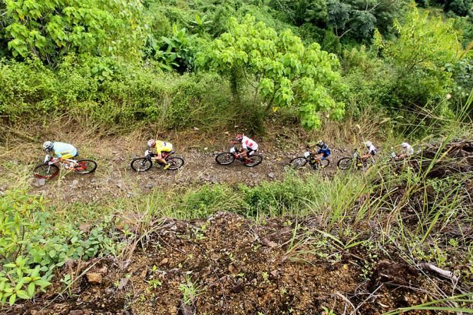 Riders on a big mountain climb