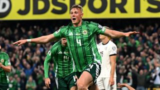 Daniel Ballard of Northern Ireland celebrates scoring a goal which was later ruled out for offside during the FIFA World Cup 2026 qualifier match between Northern Ireland and Germany at Windsor Park on October 13, 2025 in Belfast, Northern Ireland. 