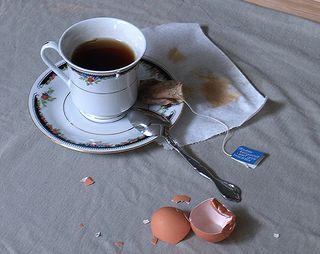 Reference images: photo of a teacup with a broken egg