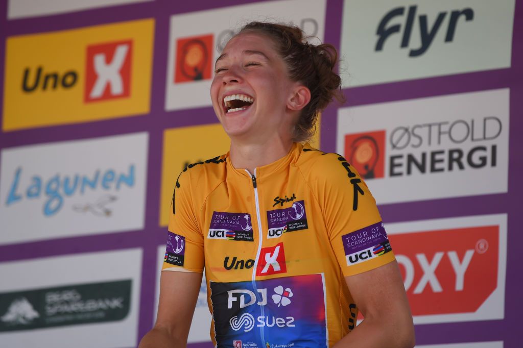HALDEN NORWAY AUGUST 14 Cecilie Uttrup Ludwig of Denmark and Team FDJ Nouvelle Aquitaine Futuroscope Yellow Leader Jersey celebrates with champagne at podium as final overall winner during the 8th Tour of Scandinavia 2022 Battle Of The North Stage 6 a 1543km stage from Lillestrm to Halden UCIWWT tourofscandinavia TOSC22 on August 14 2022 in Halden Norway Photo by Luc ClaessenGetty Images