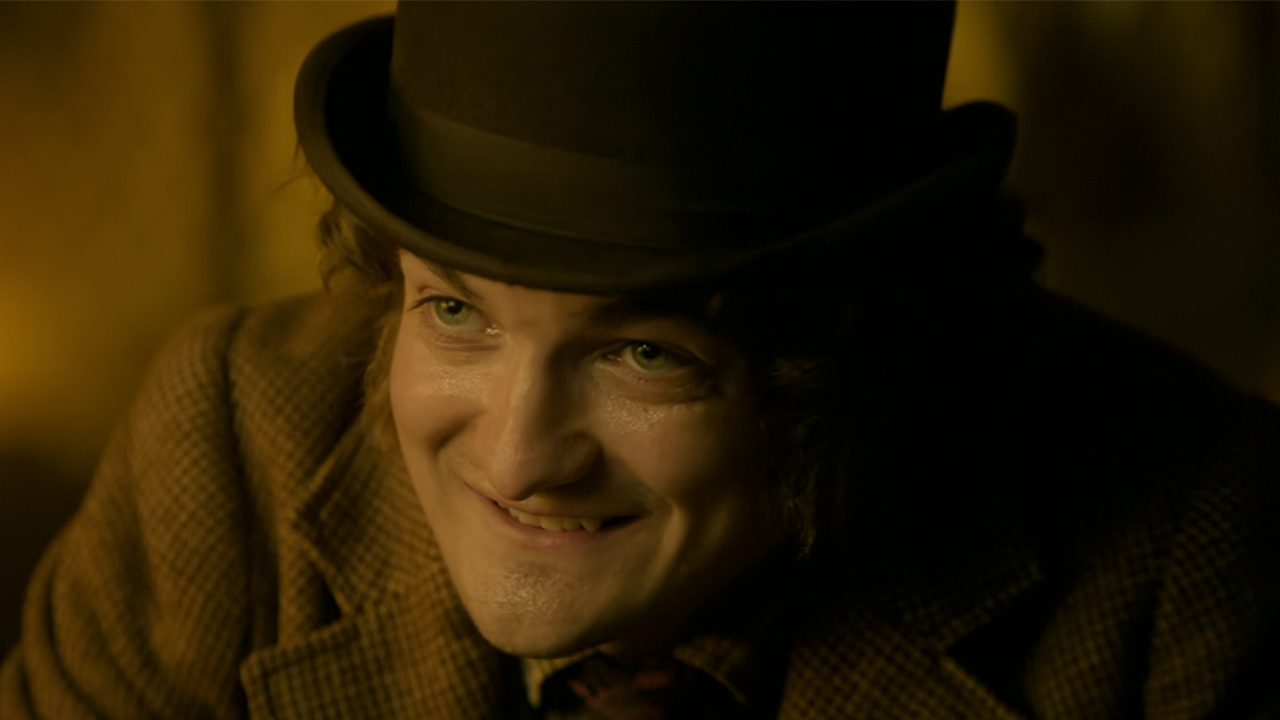 A close up of Jack Gleeson smiling in House of Guinness.