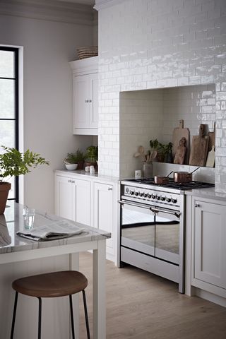 Modern white kitchen with glazed white tiles