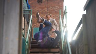 Adam Barlow falls down the stairs during a row with David Platt in Coronation Street.