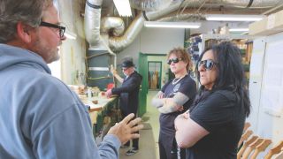 (from left) Joe Knaggs and Peter Wolf at Knaggs’ factory with Billy Idol guitarists Billy Morrison and Steve Stevens