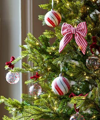 Close up of Christmas tree with red, white and green ornaments