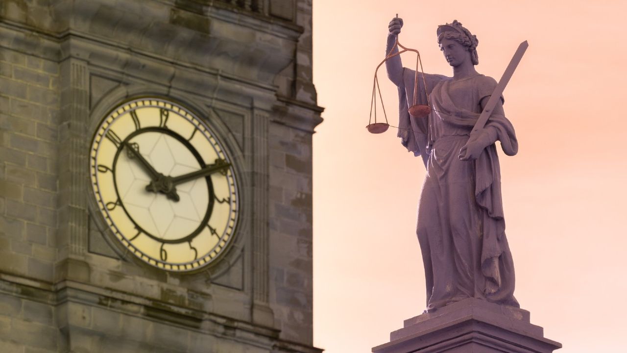 Close-up view of the Lady Justice statue above the entrance to the former Crown Court House in Wakefield, England