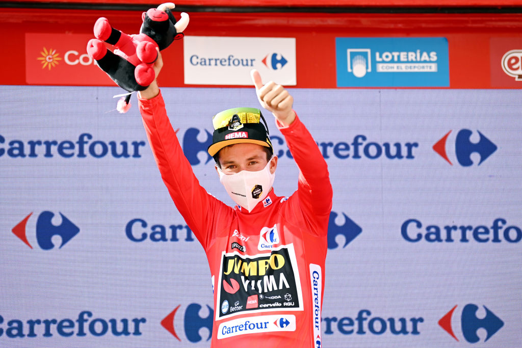 BURGOS SPAIN AUGUST 15 Primoz Roglic of Slovenia and Team Jumbo Visma celebrates winning the Red Leader Jersey on the podium ceremony after the 76th Tour of Spain 2021 Stage 2 a 1667km stage from Caleruega Monasterio de Santo Domingo de Guzmn to Burgos Gamonal lavuelta LaVuelta21 CapitalMundialdelCiclismo on August 15 2021 in Burgos Spain Photo by Stuart FranklinGetty Images