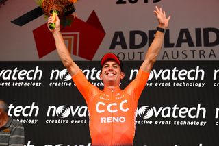 Patrick Bevin celebrates on the podium after winning stage 2 at the Tour Down Under