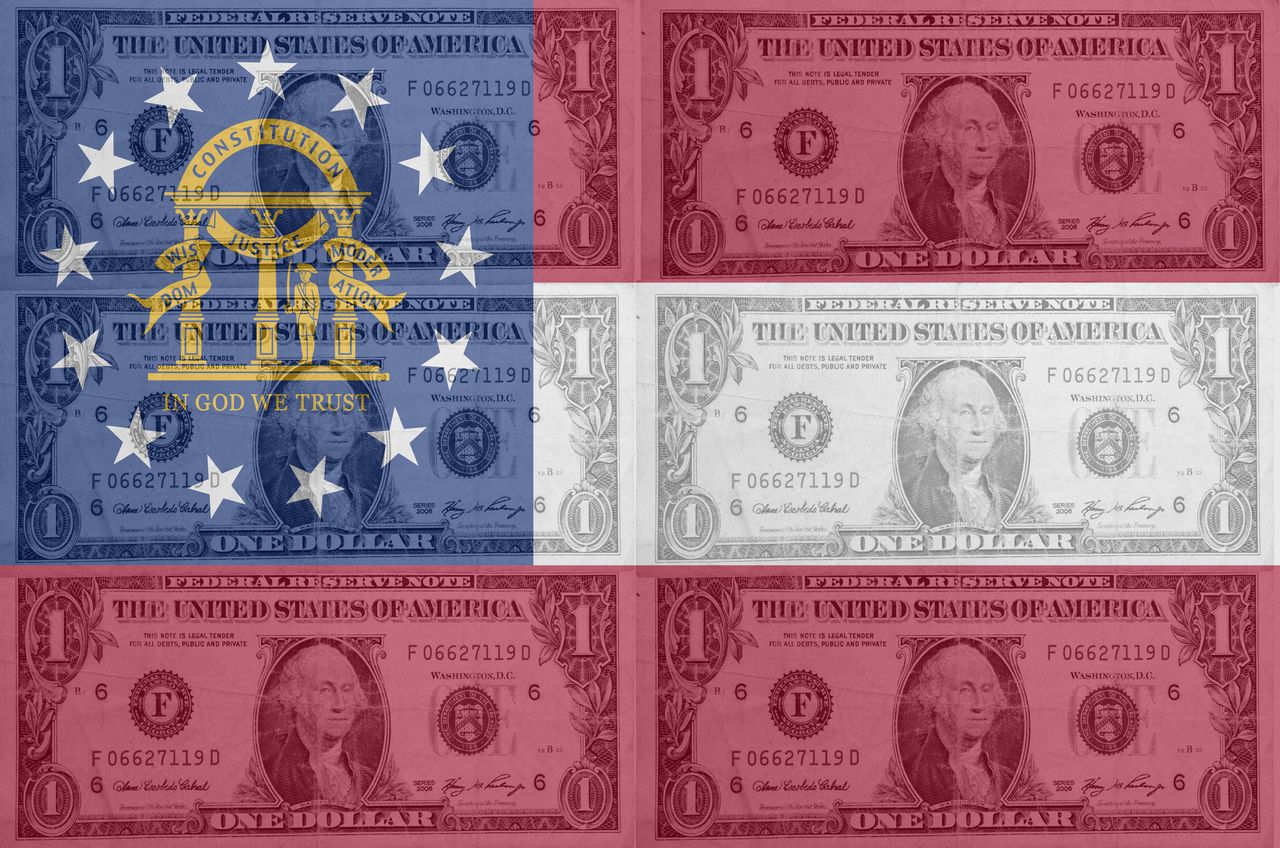 U.S. one dollar bills overlayed with the state flag of Georgia