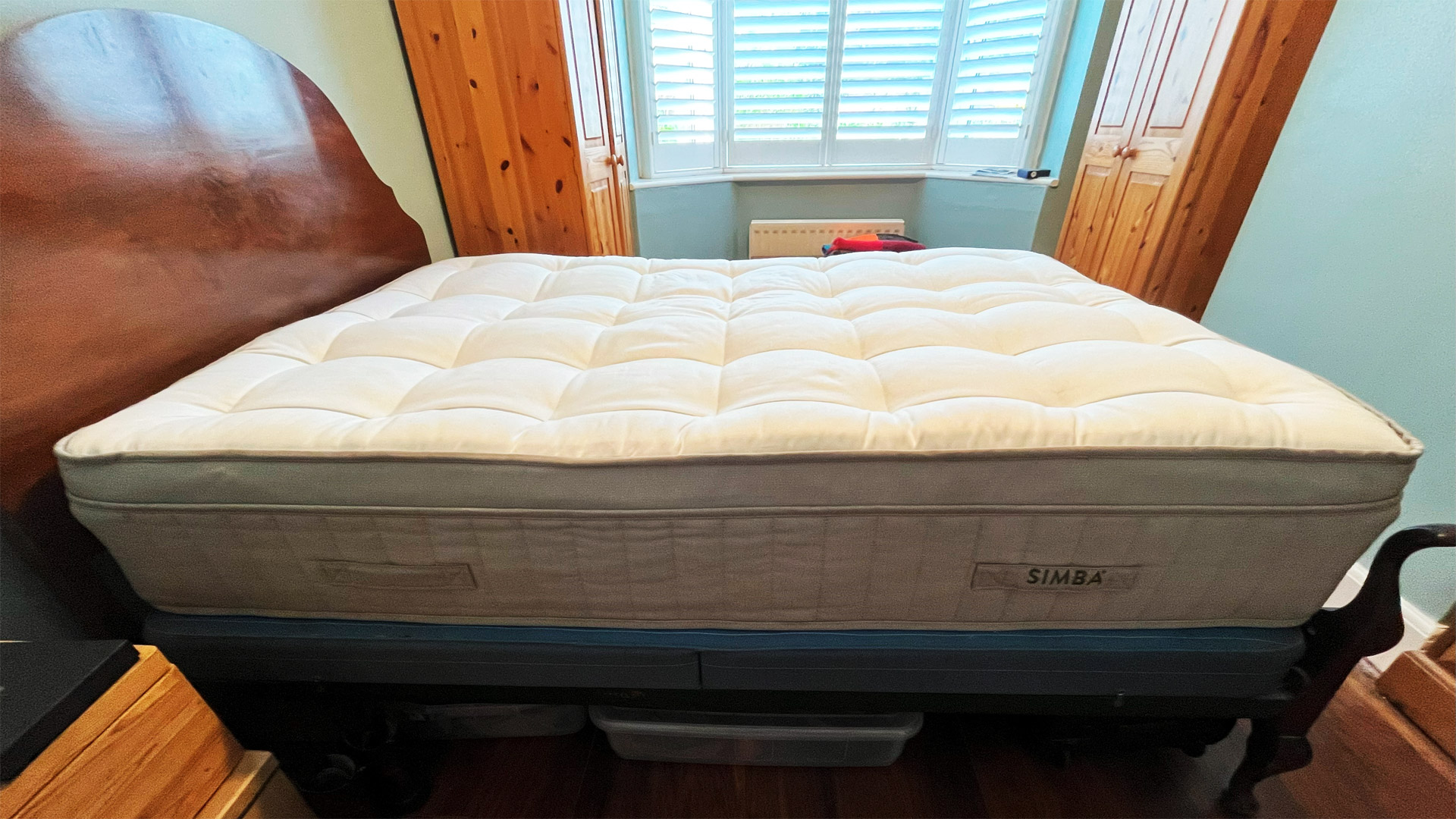 The Simba Earth Apex mattress on a bed in a bedroom