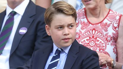Prince George of Wales watches during day fourteen of The Championships Wimbledon 2025