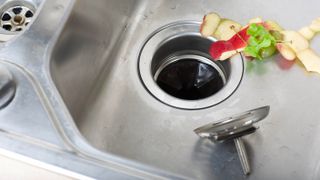 A garbage disposal with food scraps