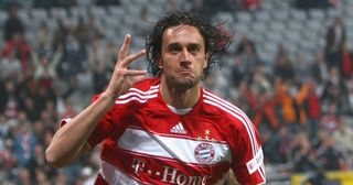 Luca Toni celebrates scoring the opening goal during the Bundesliga match between FC Bayern Muenchen and Bayer 04 Leverkusen at Allianz Arena on May 12, 2009 in Munich, Germany.