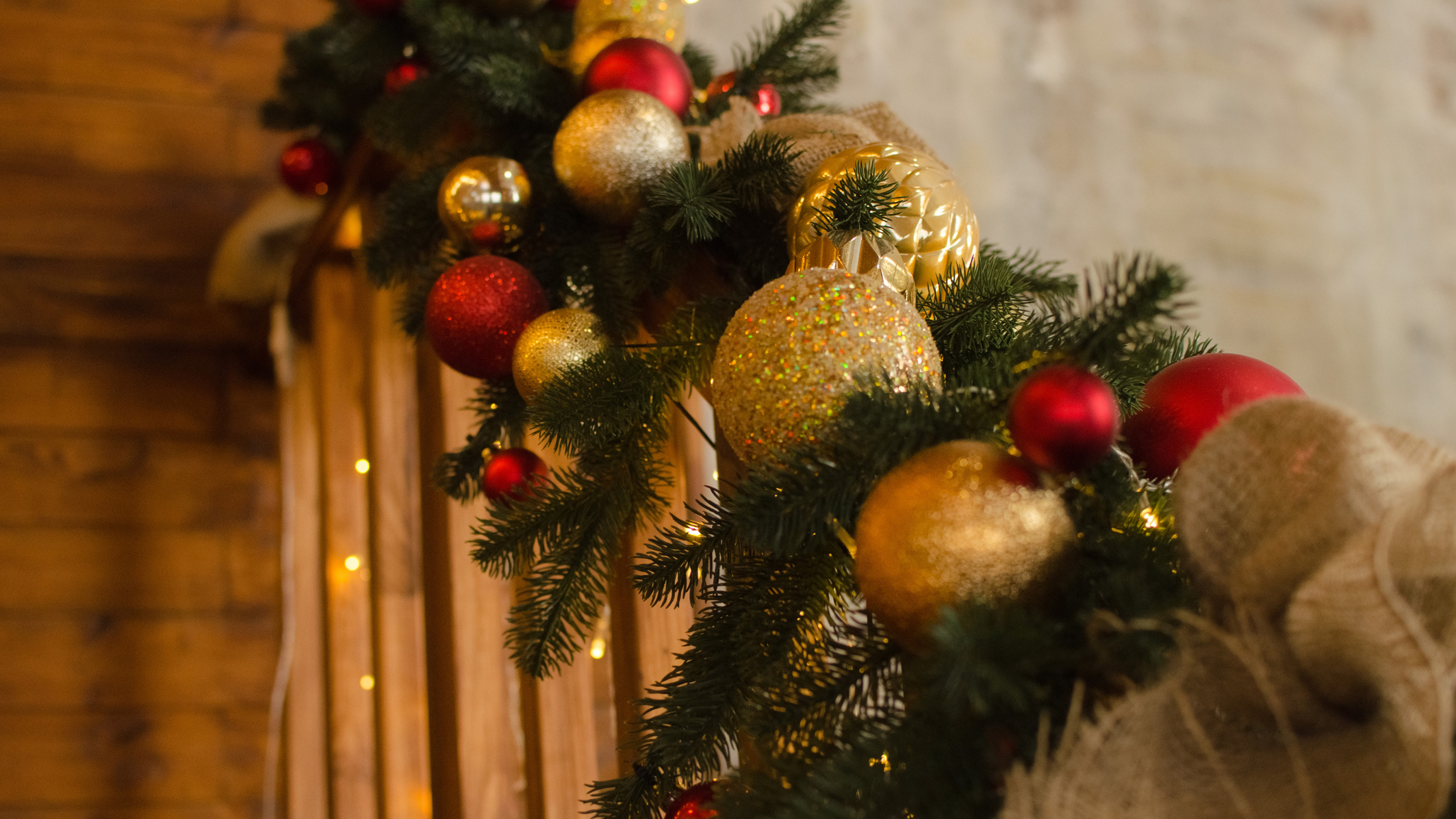 A Christmas garland going up a staircase bannister