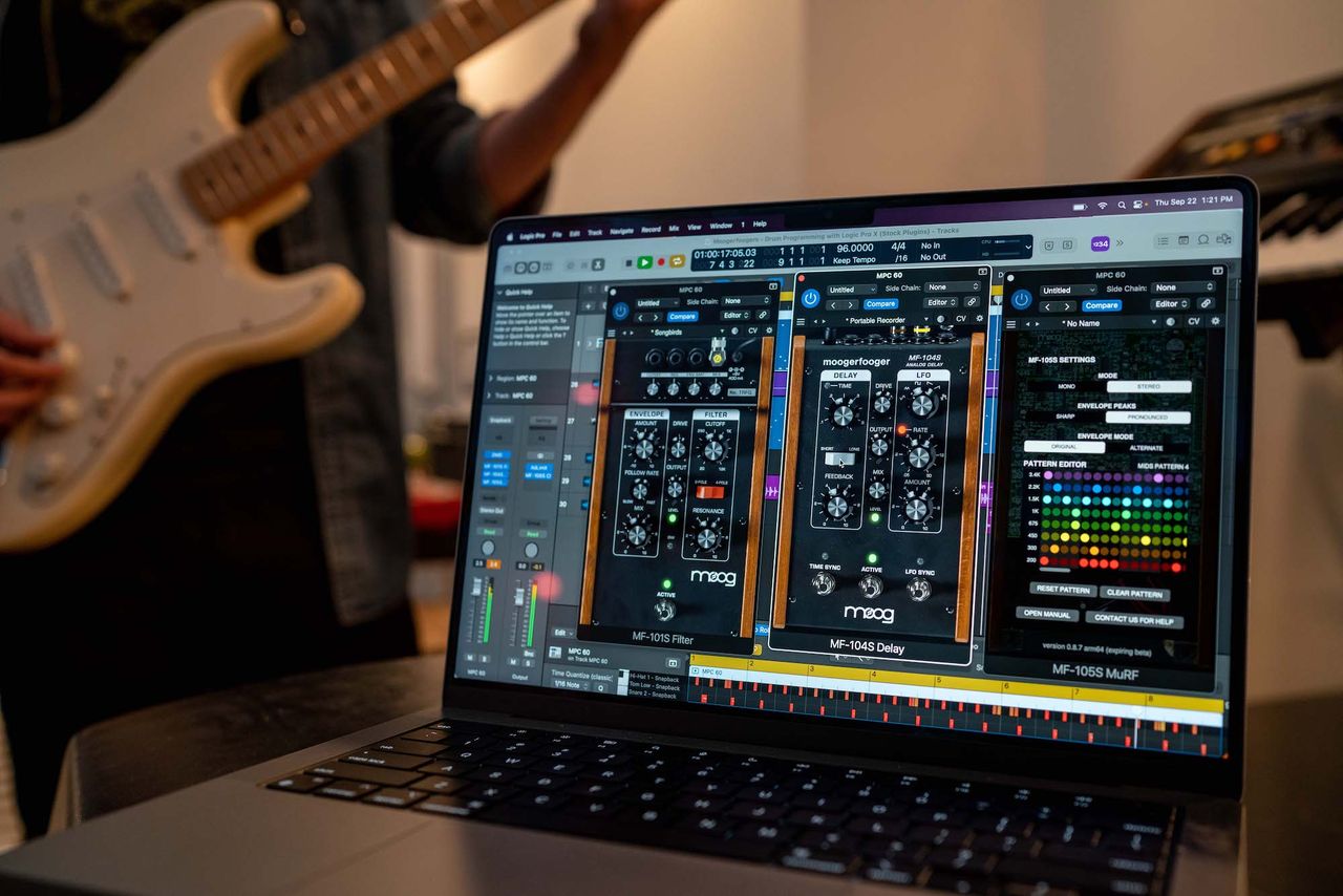 A guitarist runs Moog's Moogerfooger plugins on their computer