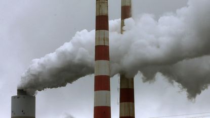 Emissions spew out of a large stack at the coal fired Morgantown Generating Station, Maryland