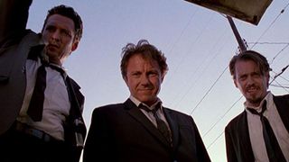 Quentin Tarantino - still from Reservoir Dogs - men in front of blue sky