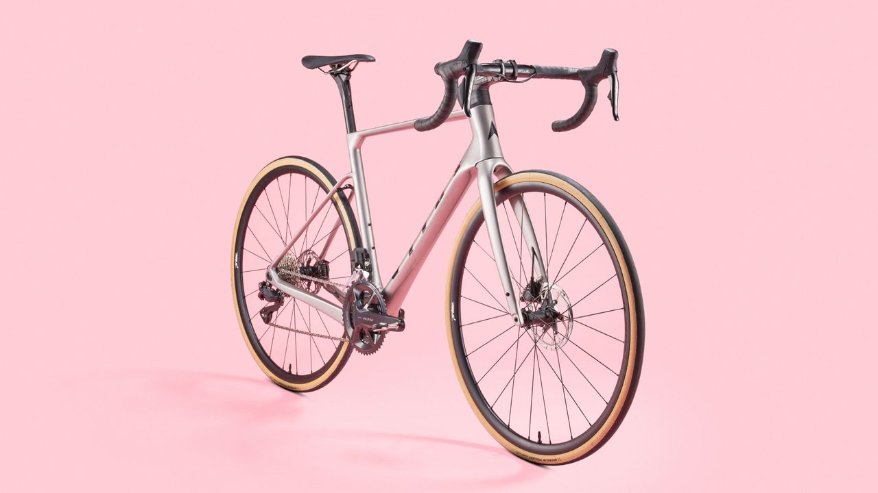 Vitus Venon Evo-RS 105 Di2 road bike on a pink background